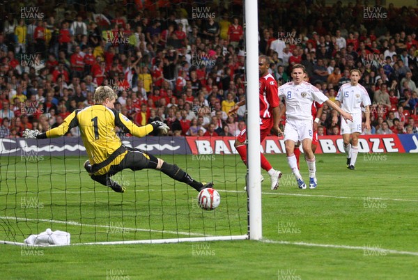 09.09.09 Wales v Russia... Russia's Igor Semshov scoring goal past Wales' keeper Wayne Hennessey . 