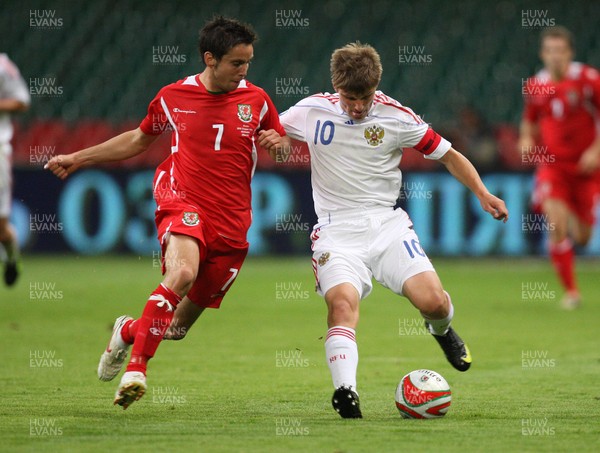 09.09.09 Wales v Russia... Russia's Andrey Arshavin being challenged by Wales' Brian Stock  . 