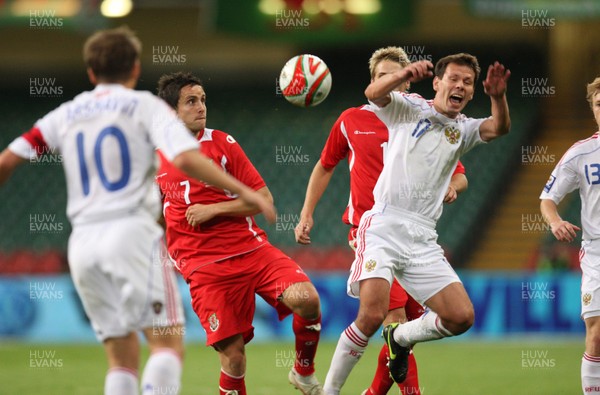 09.09.09 Wales v Russia... Russia's Konstantin Zyryanov being challenged by Wales' Brian Stock. 