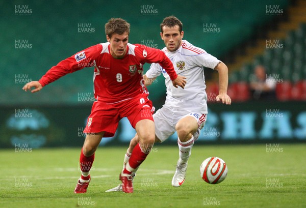 09.09.09 Wales v Russia... Wales' Aaron Ramsey holding of the challenge of Russia's Alexander Kerzhakov. 