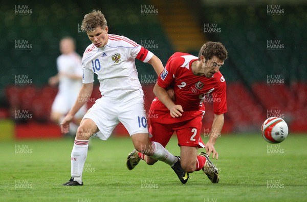 09.09.09 - Wales v Russia, World Cup Qualifying Group 4 -  Russia's Andrey Arshavin tangles with Wales' Sam Ricketts  