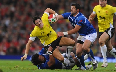 13.11.09 - Wales v Samoa - Invesco Perpetual Series 2009 - Wales' James Hook takes on Samoa's Seilala Mapusua and Gavin Williams. 