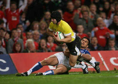 13.11.09 Wales v Samoa... Wales' Leigh Halfpenny scores try despite tackle by Samoa's David Lemi. 