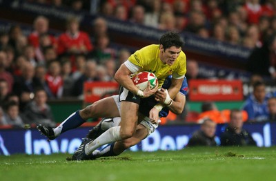 13.11.09 Wales v Samoa... Wales' James Hook is tackled Samoa's David Lemi.. 