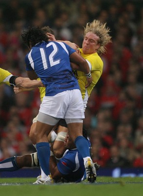 13.11.09 Wales v Samoa... Wales' Andy Powell is tackled by Samoa's Seilala Mapusua. 