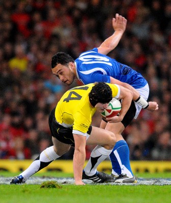 13.11.09 - Invesco Perpetual International Rugby, Wales v Samoa Wales' Leigh Halfpenny tries to get past Samoa's Fa'atonu Fili 