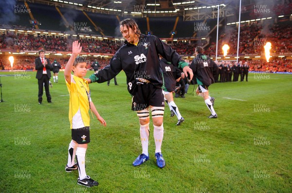 13.11.09 - Wales v Samoa - Invesco Perpetual Series 2009 - Wales' Ryan Jones leads out his team with mascot Henry Walters. 