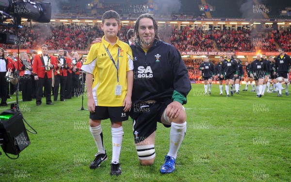 13.11.09 - Wales v Samoa - Invesco Perpetual Series 2009 - Wales' Ryan Jones leads out his team with mascot Henry Walters. 