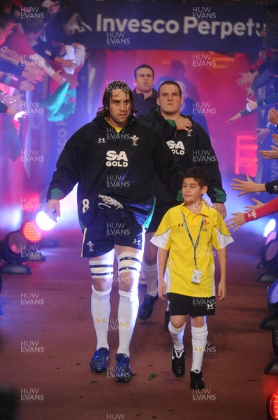 13.11.09 - Wales v Samoa - Invesco Perpetual Series 2009 - Wales' Ryan Jones leads out his team with mascot Henry Walters. 