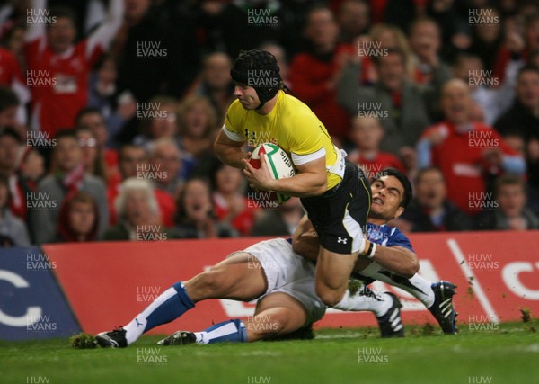 13.11.09 Wales v Samoa... Wales' Leigh Halfpenny scores try despite tackle by Samoa's David Lemi. 