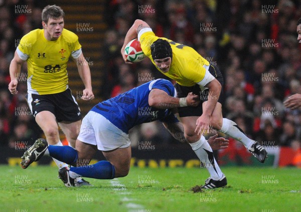13.11.09 - Invesco Perpetual International Rugby, Wales v Samoa Wales' Tom James is tackled by Samoa's Mahonri Schwalger 