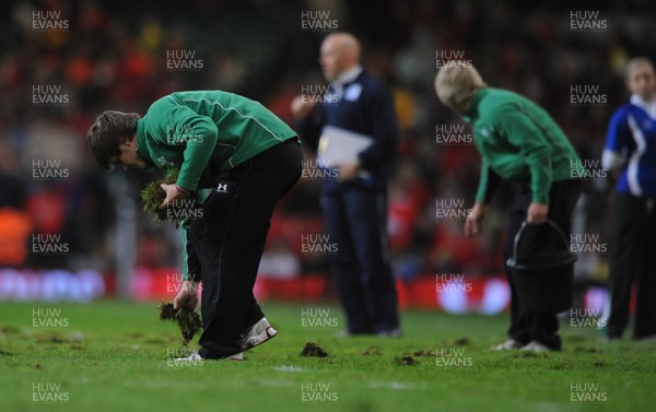 13.11.09 - Wales v Samoa - Invesco Perpetual Series 2009 - Millennium Stadium pitch staff remove lumps of grass at half time. 
