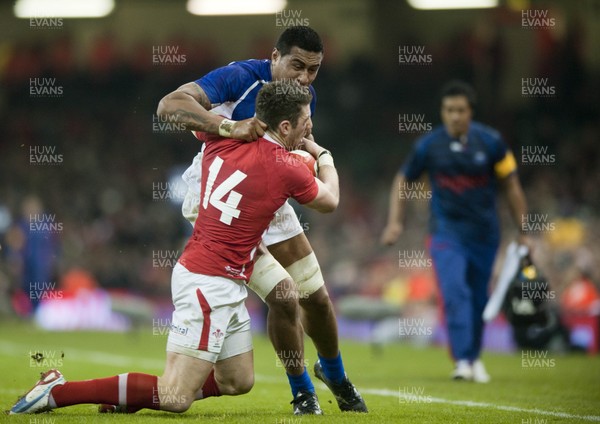 161112 - Wales v Samoa - Dove Men Series 2012 -  Samoa's Teofilo Paulo of Samoa is tackled by Wales' Alex Cuthbert     