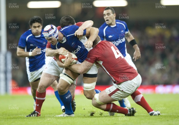 161112 - Wales v Samoa - Dove Men Series 2012 -  Samoa's Daniel Leo of Samoa is tackled by Wales' Aaron Jarvis  and  Wales' Bradley Davies     