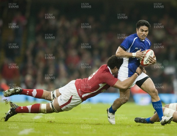 161112 - Wales v Samoa - Dove Men Series 2012 -  Samoa's David Lemi of Samoa, right is tackled by Wales' Toby Faletau      