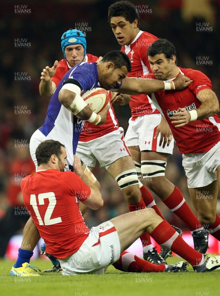 161112 - Wales v Samoa, Dove Men Series 2012 - Samoa's Ofisa Treviranus is tackled by Wales' Jamie Roberts and Mike Phillips