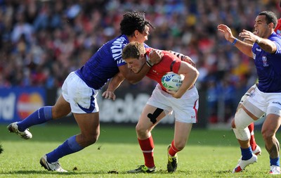 18.09.11 - Wales v Samoa - Rugby World Cup 2011 - Rhys Priestland of Wales is tackled by Maurie Faasavalu of Samoa. 