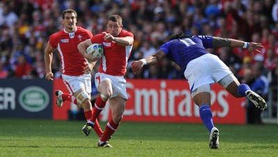 18.09.11 - Wales v Samoa - Rugby World Cup 2011 - Shane Williams of Wales takes on Anitelea Tuilagi of Samoa. 