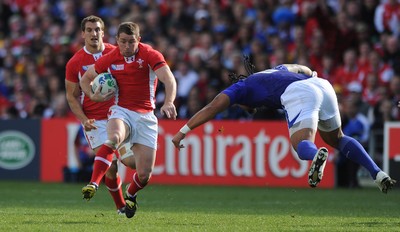 18.09.11 - Wales v Samoa - Rugby World Cup 2011 - Shane Williams of Wales takes on Anitelea Tuilagi of Samoa. 