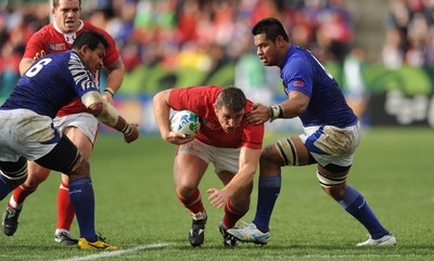 18.09.11 - Wales v Samoa - Rugby World Cup 2011 - Huw Bennett of Wales is tackled by George Stowers of Samoa. 
