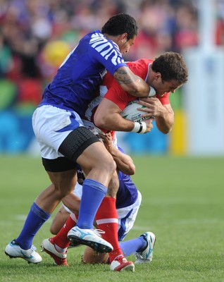 18.09.11 - Wales v Samoa - Rugby World Cup 2011 - Jamie Roberts of Wales takes on George Pisi and Tusi Pisi of Samoa. 