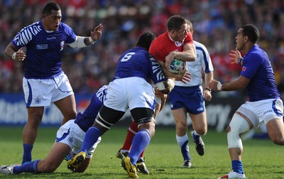 18.09.11 - Wales v Samoa - Rugby World Cup 2011 - Shane Williams of Wales is tackled by Ofisa Treviranus of Samoa. 