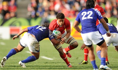 18.09.11 - Wales v Samoa - Rugby World Cup 2011 - Toby Faletau of Wales is tackled by Seilala Mapusua of Samoa. 