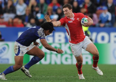 18.09.11 - Wales v Samoa - Rugby World Cup 2011 - George North of Wales is tackled by Maurie Faasavalu of Samoa. 