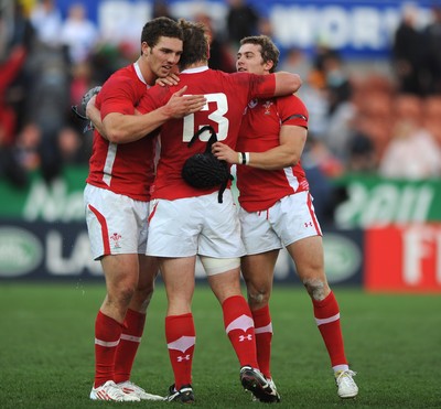 18.09.11 - Wales v Samoa - Rugby World Cup 2011 - George North, Jonathan Davies and Leigh Halfpenny celebrate at the end of the game. 