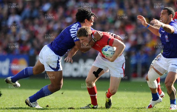 18.09.11 - Wales v Samoa - Rugby World Cup 2011 - Rhys Priestland of Wales is tackled by Maurie Faasavalu of Samoa. 