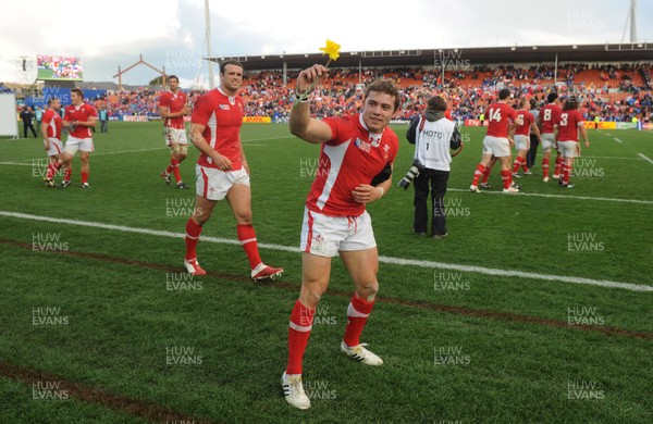 18.09.11 - Wales v Samoa - Rugby World Cup 2011 - Leigh Halfpenny of Wales receives a daffodil from a fan at the end of the game. 