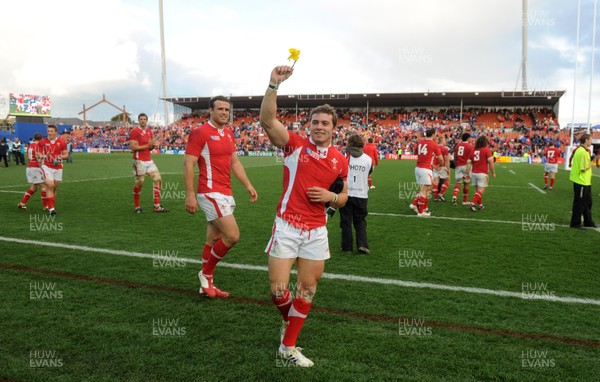 18.09.11 - Wales v Samoa - Rugby World Cup 2011 - Leigh Halfpenny of Wales receives a daffodil from a fan at the end of the game. 