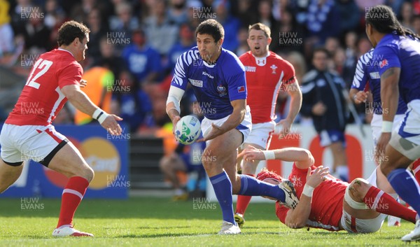 18.09.11 - Wales v Samoa - Rugby World Cup 2011 - Paul Williams of Samoa is tackled by Alun Wyn Jones of Wales. 
