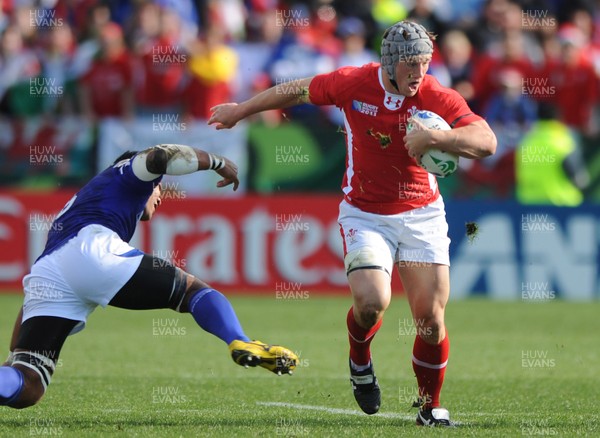 18.09.11 - Wales v Samoa - Rugby World Cup 2011 - Jonathan Davies of Wales takes on Ofisa Treviranus of Samoa. 