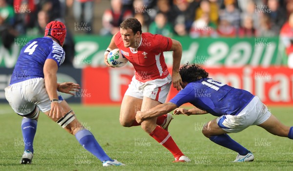 18.09.11 - Wales v Samoa - Rugby World Cup 2011 - Jamie Roberts of Wales is tackled by Tusi Pisi of Samoa. 