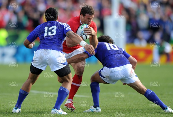 18.09.11 - Wales v Samoa - Rugby World Cup 2011 - Jamie Roberts of Wales takes on George Pisi and Tusi Pisi of Samoa. 