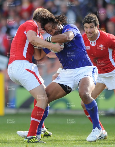 18.09.11 - Wales v Samoa - Rugby World Cup 2011 - Seilala Mapusua of Samoa is tackled by Rhys Priestland of Wales. 