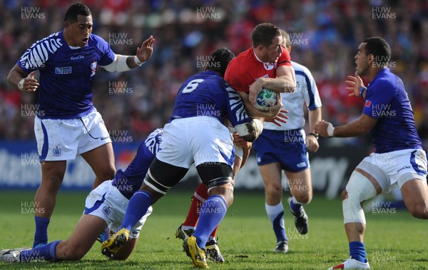 18.09.11 - Wales v Samoa - Rugby World Cup 2011 - Shane Williams of Wales is tackled by Ofisa Treviranus of Samoa. 