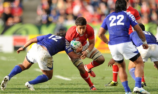 18.09.11 - Wales v Samoa - Rugby World Cup 2011 - Toby Faletau of Wales is tackled by Seilala Mapusua of Samoa. 