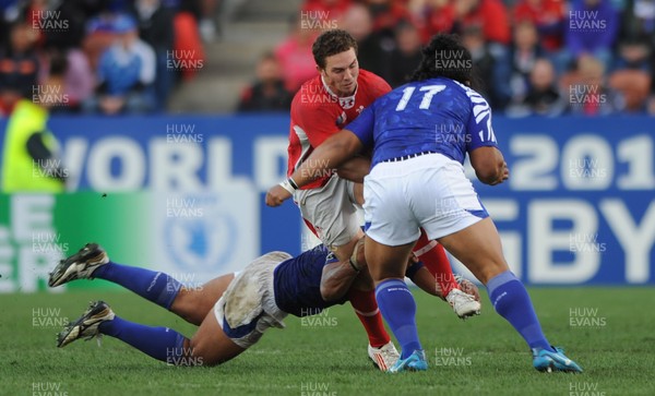 18.09.11 - Wales v Samoa - Rugby World Cup 2011 - George North of Wales is tackled by Maurie Faasavalu of Samoa. 