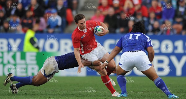 18.09.11 - Wales v Samoa - Rugby World Cup 2011 - George North of Wales is tackled by Maurie Faasavalu of Samoa. 
