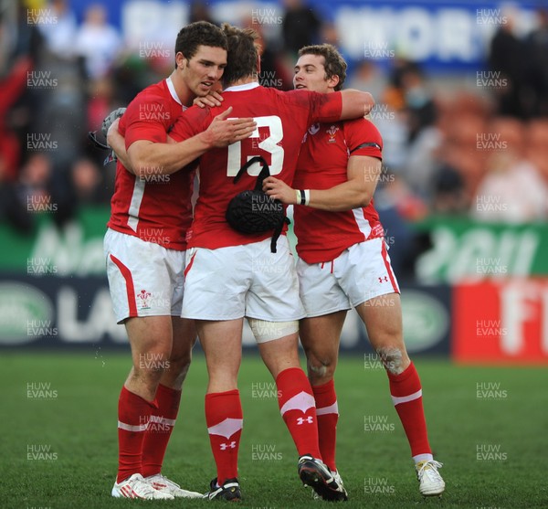 18.09.11 - Wales v Samoa - Rugby World Cup 2011 - George North, Jonathan Davies and Leigh Halfpenny celebrate at the end of the game. 