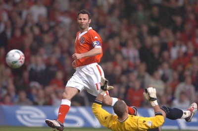 28.03.07 - Wales v San Marino - UEFA Euro 2008 Qualifying Group D - Wales' Ryan Giggs chips the ball past Aldo Simoncini to score goal 