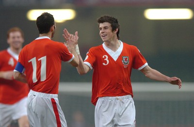 28.03.07 - Wales v San Marino - UEFA Euro 2008 Qualifying Group D - Wales' Gareth Bale celebrates his goal with Ryan Giggs 