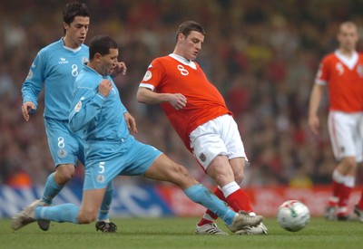 28.03.07 - Wales v San Marino - UEFA Euro 2008 Qualifying Group D - Wales' Jason Koumas is tackled by Riccardo Muccioli 