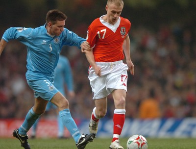 28.03.07 - Wales v San Marino - UEFA Euro 2008 Qualifying Group D - Wales' David Cotterill is tackled by Matteo Andreini 