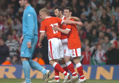 28.03.07 - Wales v San Marino - UEFA Euro 2008 Qualifying Group D - Wales' Jason Koumas celebrates scoreing from the penalty spot with Ryan Giggs(c) and  David Cotterill(L) 
