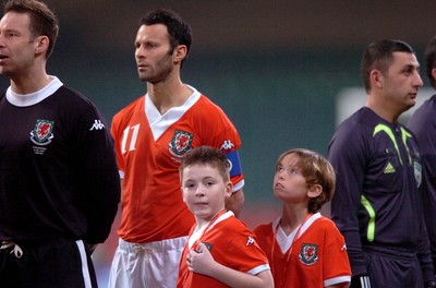 28.03.07 - Wales v San Marino - UEFA Euro 2008 Qualifying Group D - Wales' Ryan Giggs stands with mascots 