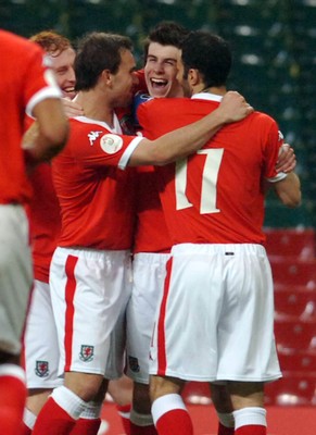 28.03.07 - Euro 2008 Qualifier Wales v San Marino Wales' Gareth Bale (ctr) is congratulated after scoring his sides second goal 