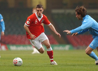 28.03.07 - Euro 2008 Qualifier Wales v San Marino Wales' Jason Koumas tries to beat Manuel Marani 